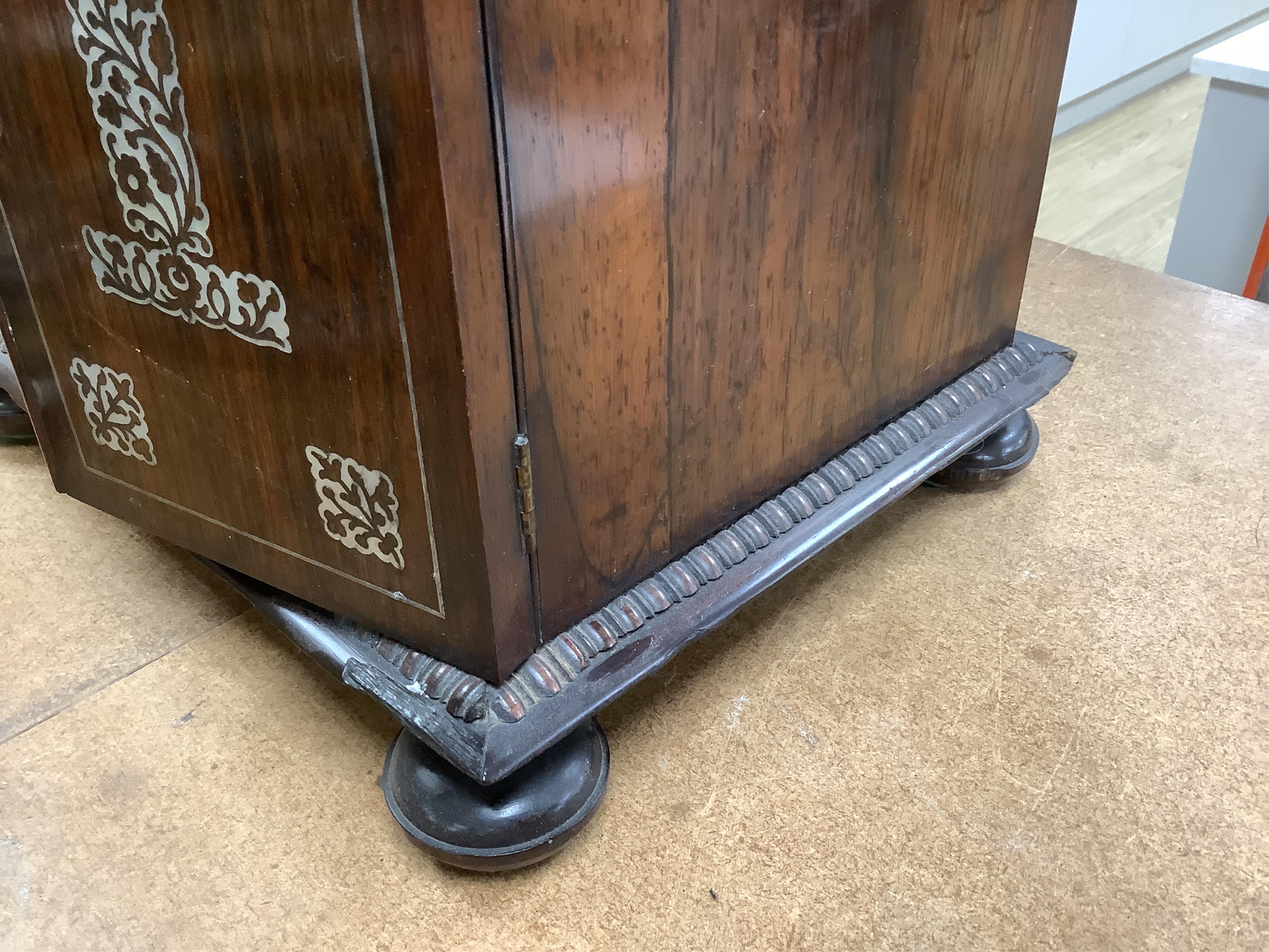 A William IV rosewood and mother of pearl inlaid sewing and writing cabinet with tooled Moroccan leather fitted interior, 37cm high